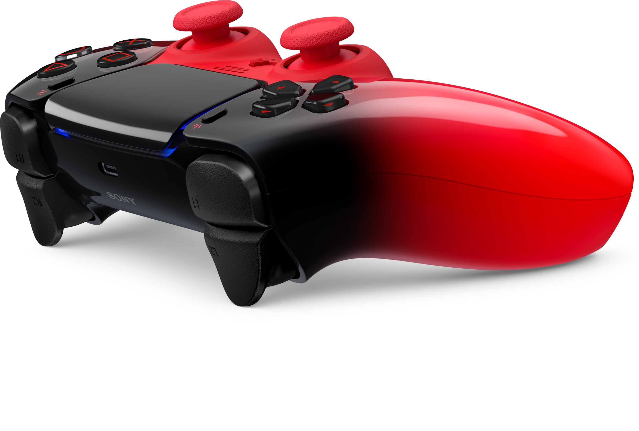 Piros és fekete kontroller két joystickkal és gombokkal.