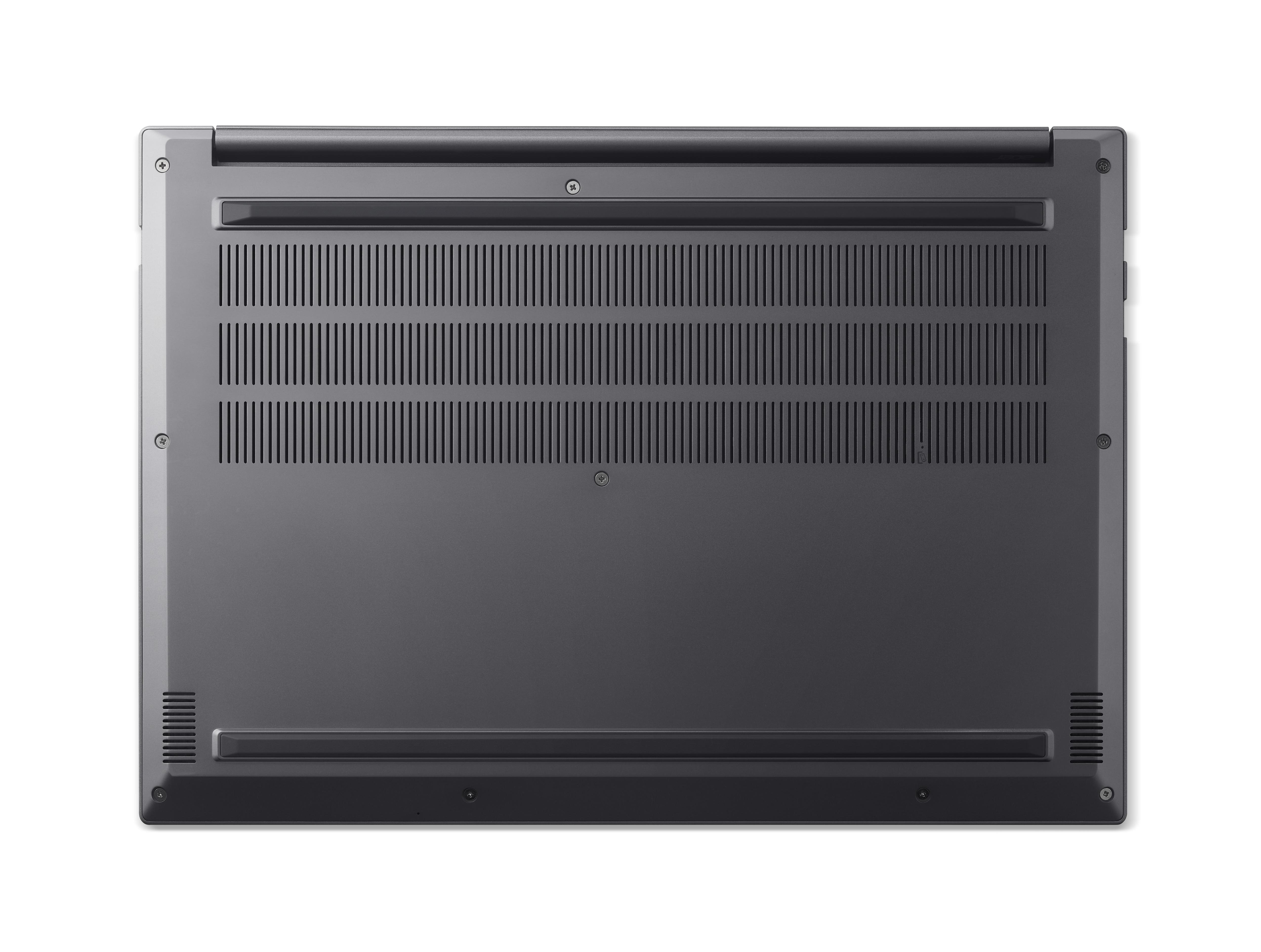 Die Unterseite eines dunklen Laptops mit Lüftungsschlitzen und Schrauben.