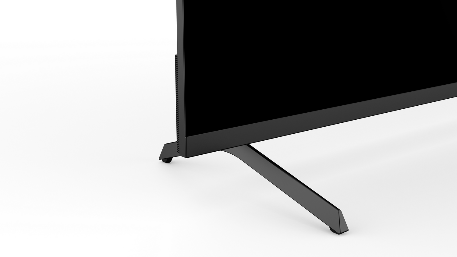 Vista de cerca de la sección inferior de un televisor negro con un soporte delgado.