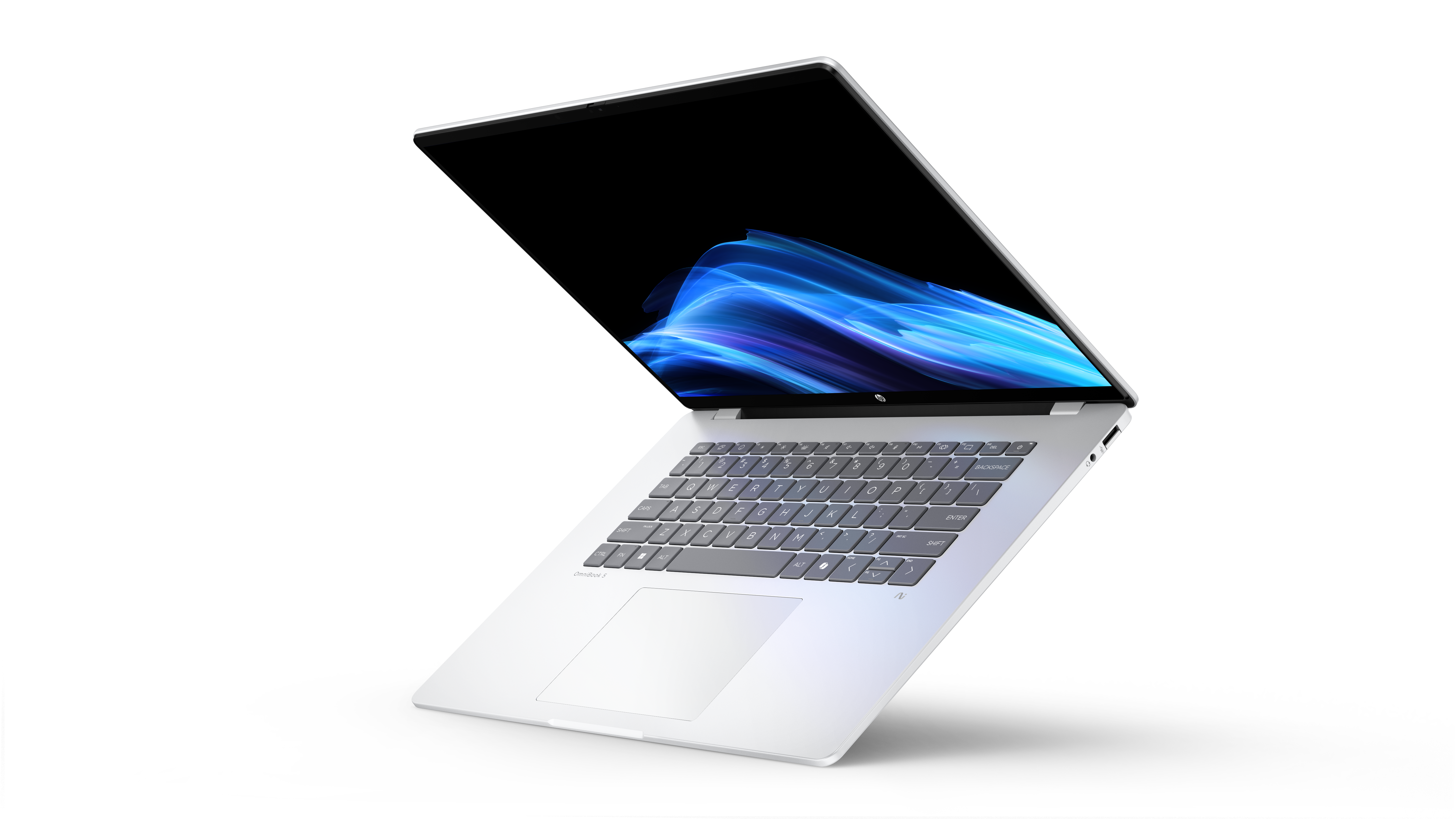 Ein silberner Laptop mit geöffnetem Bildschirm und blauer Mustergrafik.