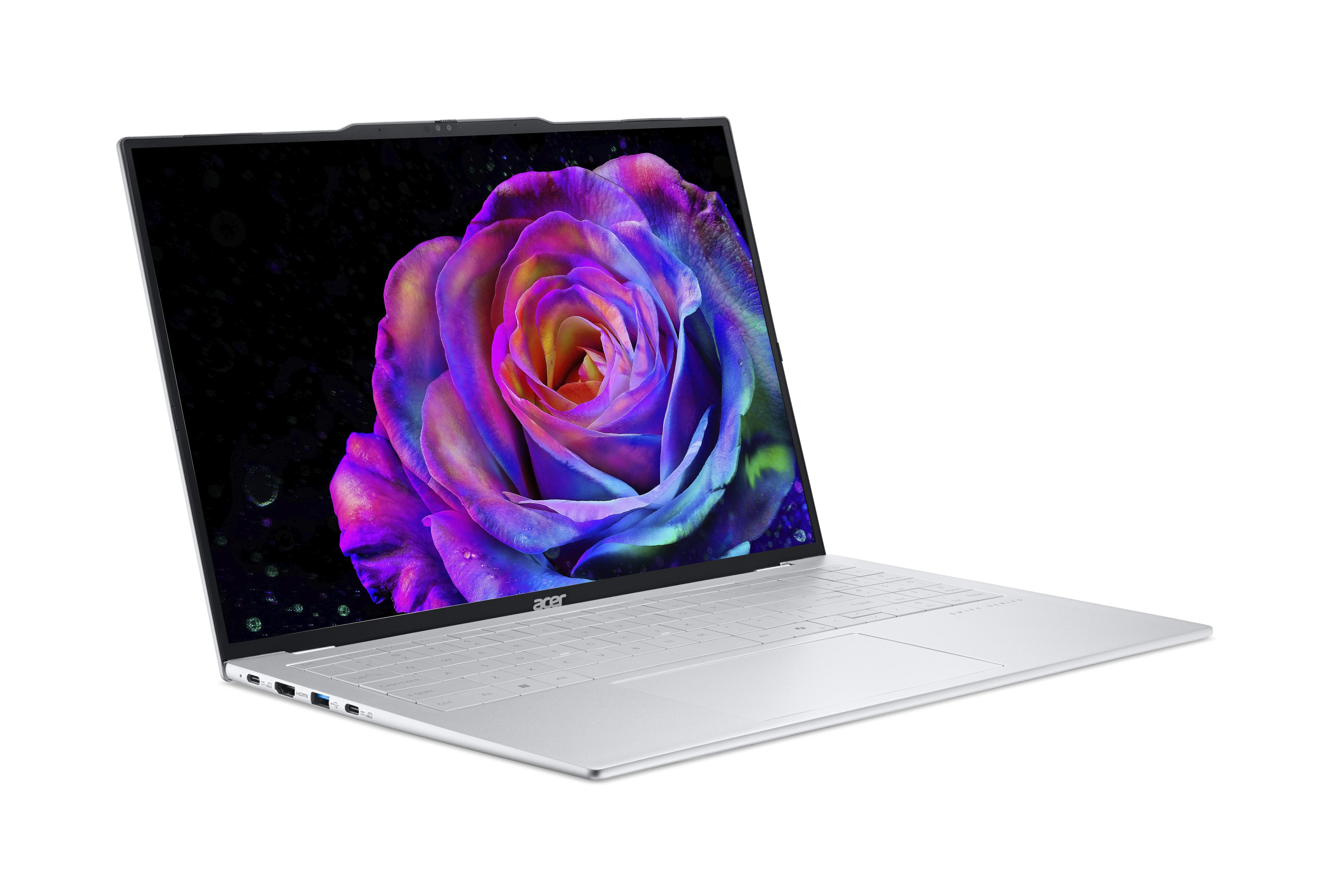 Ein silberner Laptop mit einem bunten Rosenbildschirm, weißer Hintergrund.