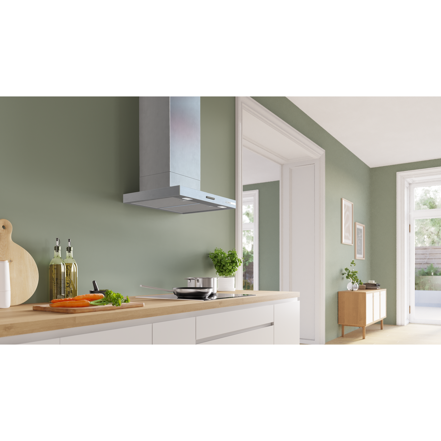 Modern kitchen with stainless steel hood, hob, and wooden countertop.