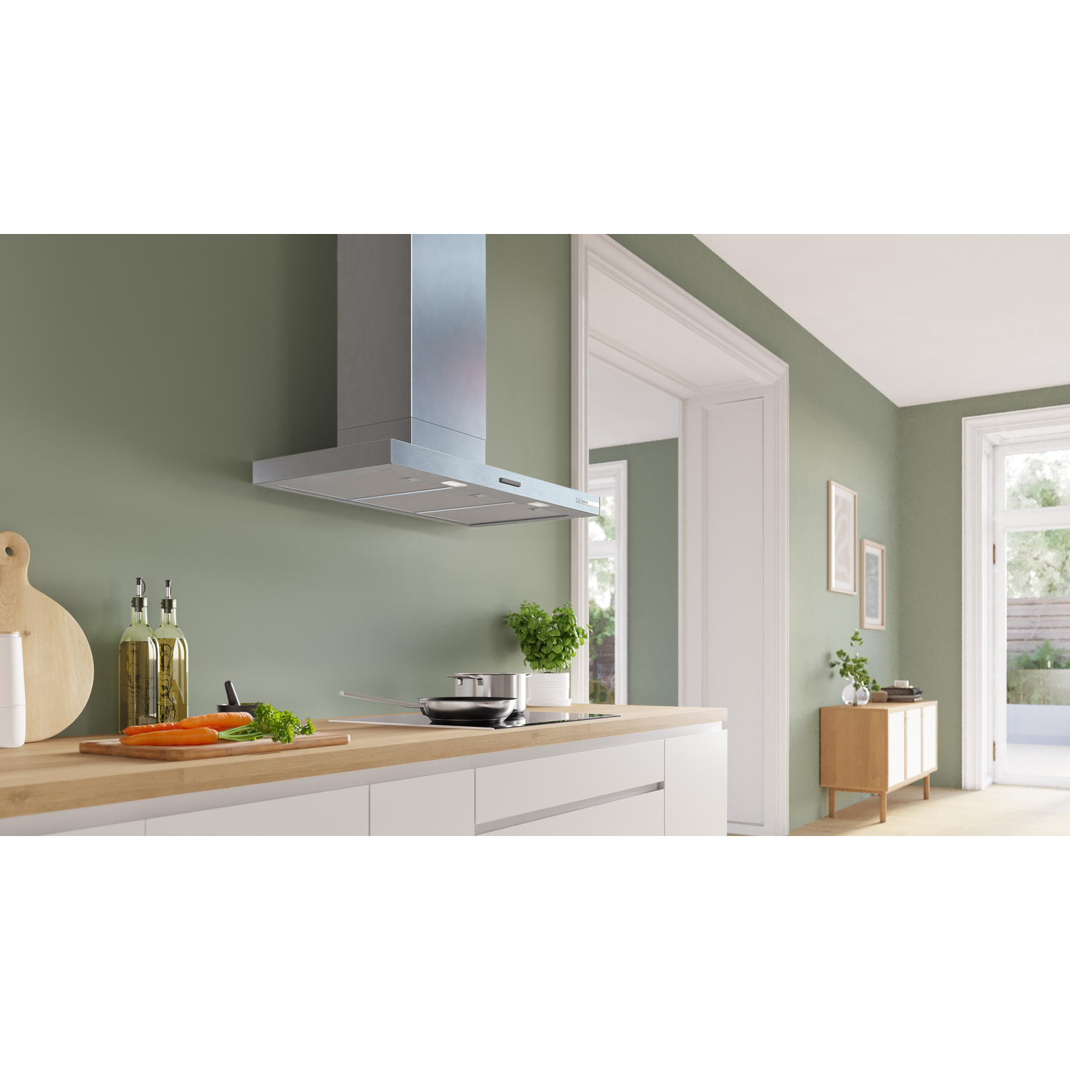 Modern kitchen with stainless steel hood, hob, and wooden countertop.