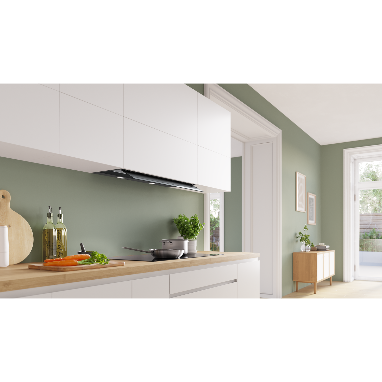 Modern kitchen with herbs, carrots, cooking utensils, and built-in cabinets.