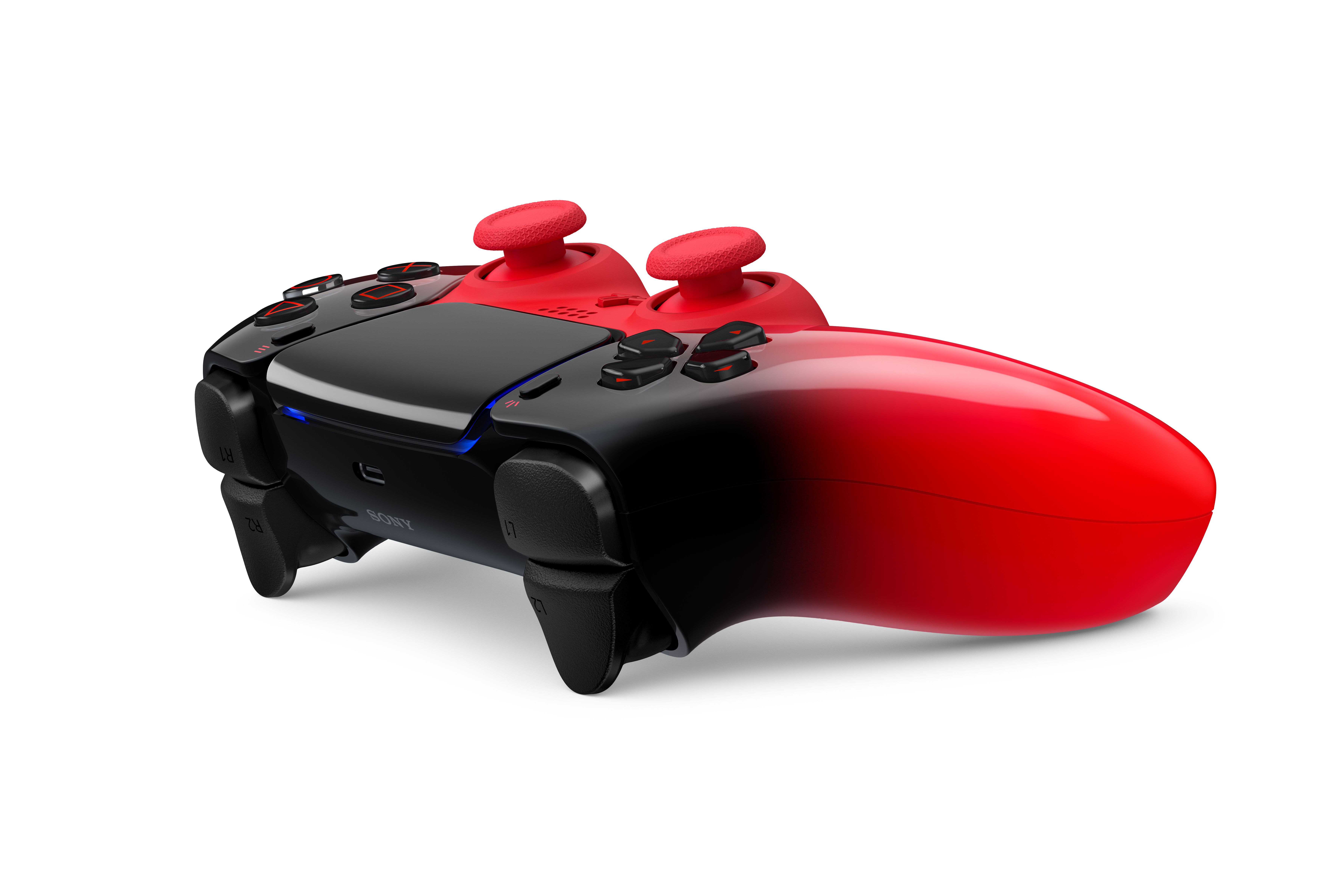 Ein roter und schwarzer Controller mit zwei roten Joysticks.