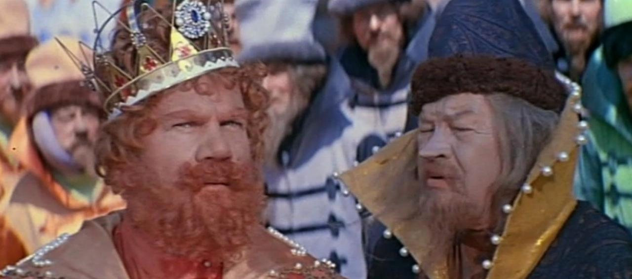 Ein Mann mit rotem Bart und Krone, links, und ein älterer Mann mit Bart, rechts.