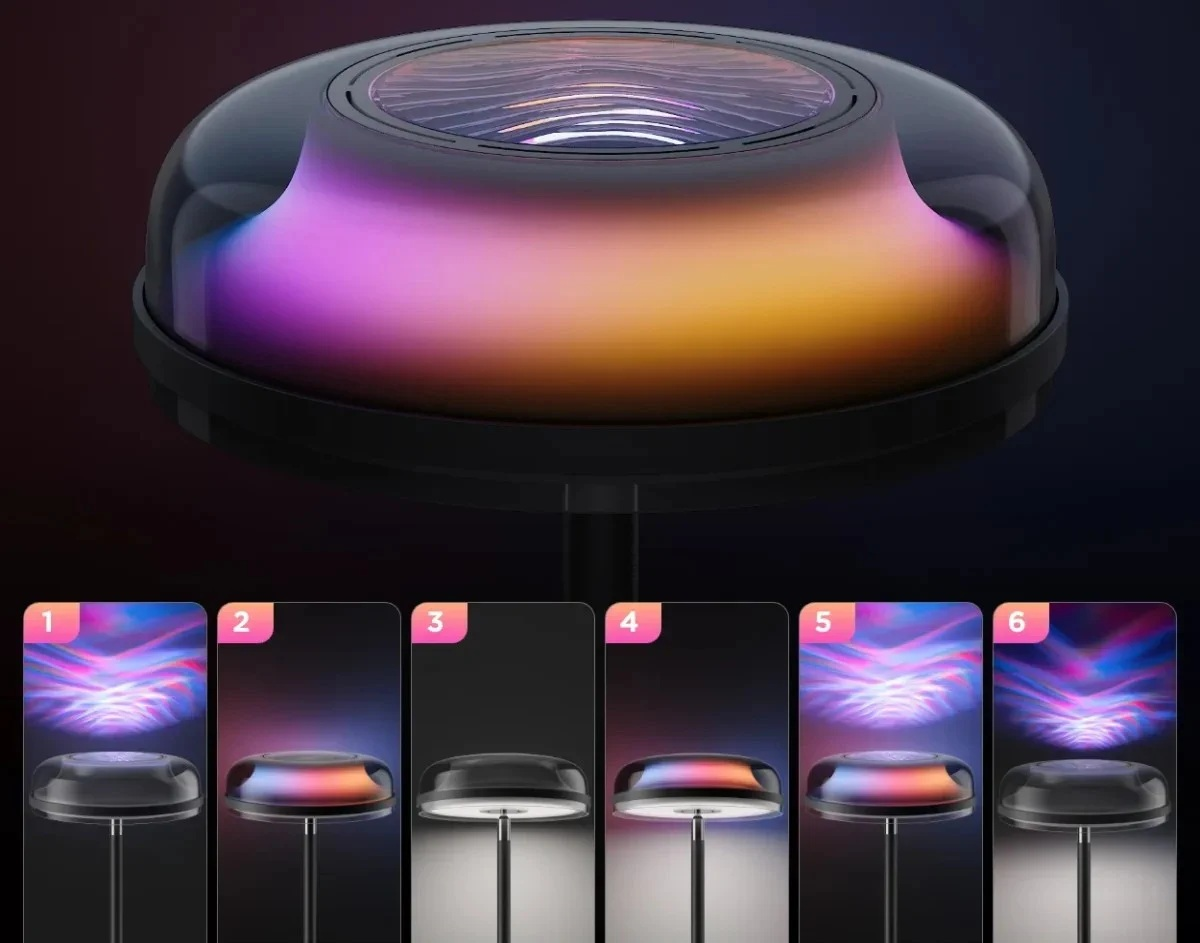 Okrągła głowica lampy z przejściem kolorów od fioletu do pomarańczu na ciemnym tle.