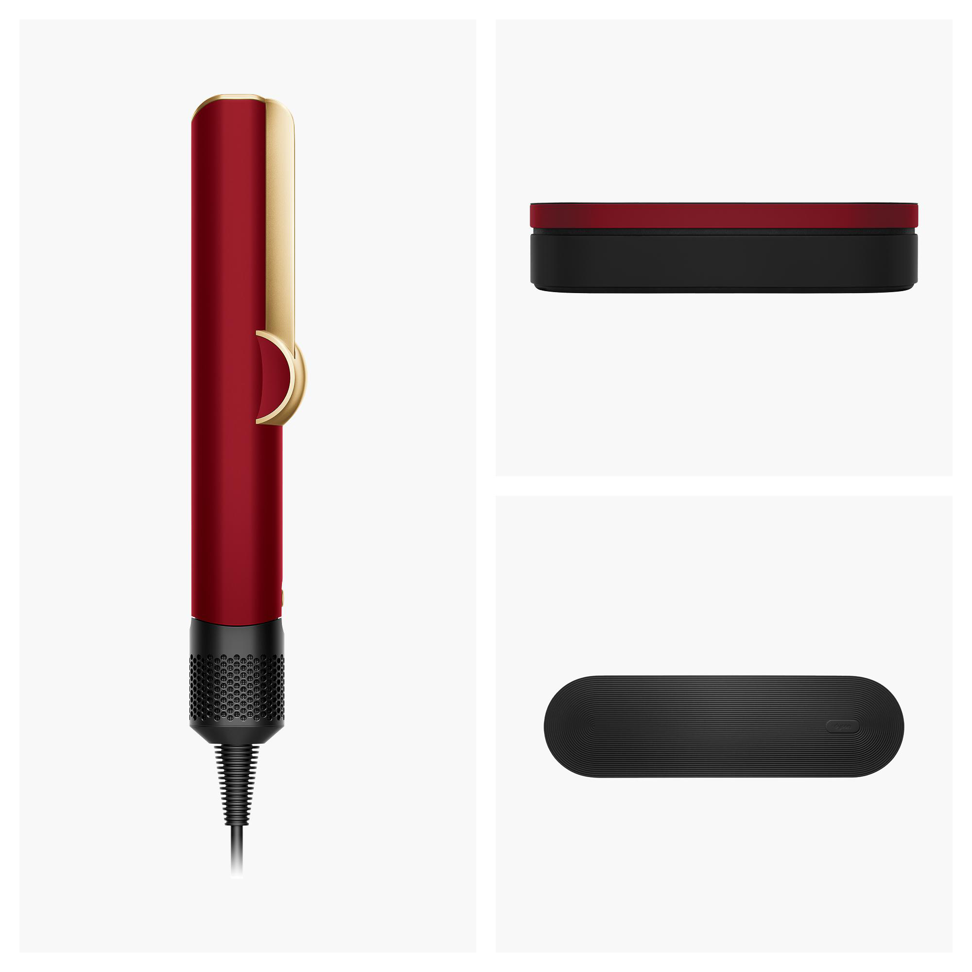 Ein roter Haartrockner mit goldenen Akzenten und schwarzem Griff.