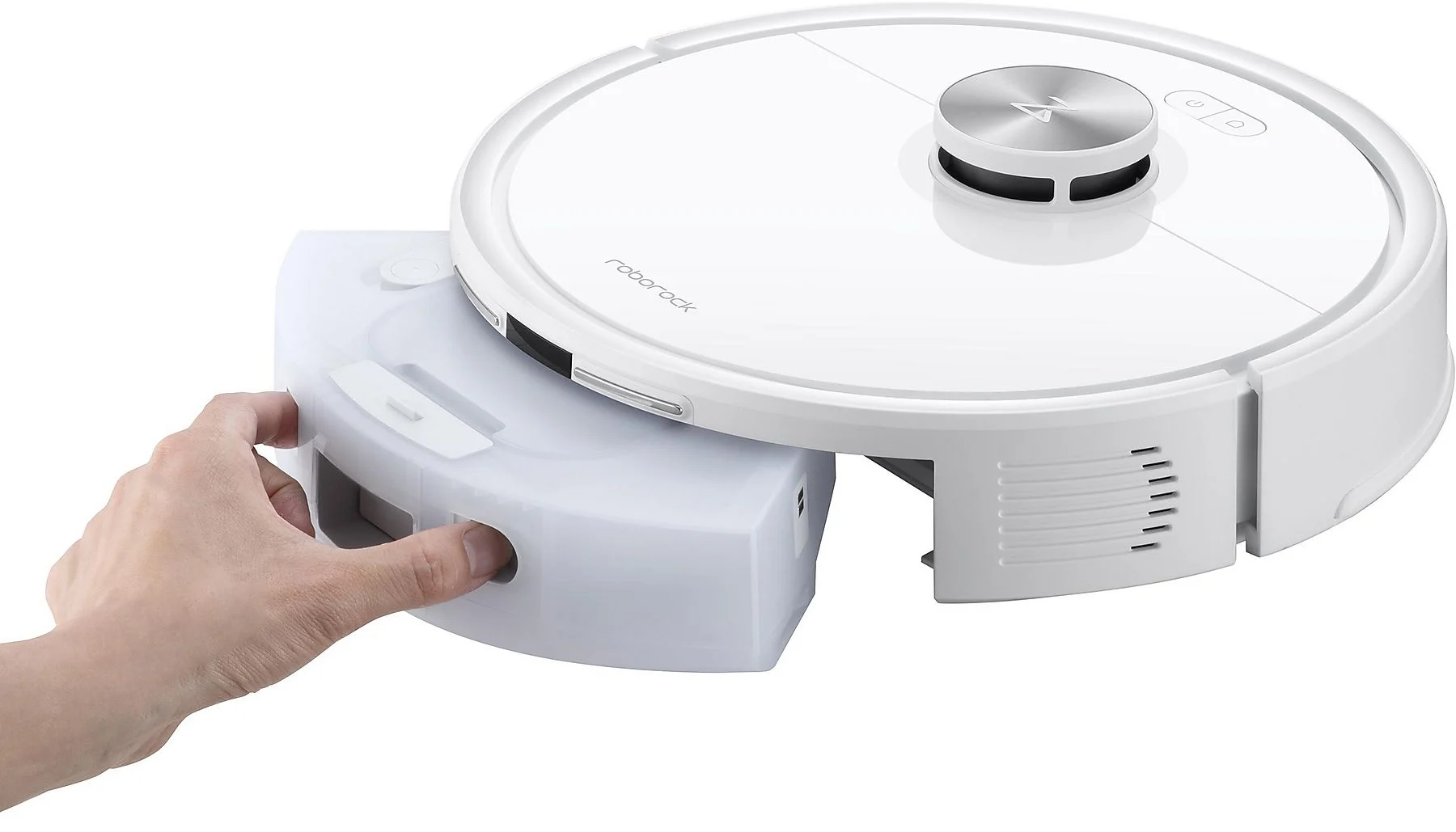 Une main insère un bac à poussière blanc dans un aspirateur robot blanc.