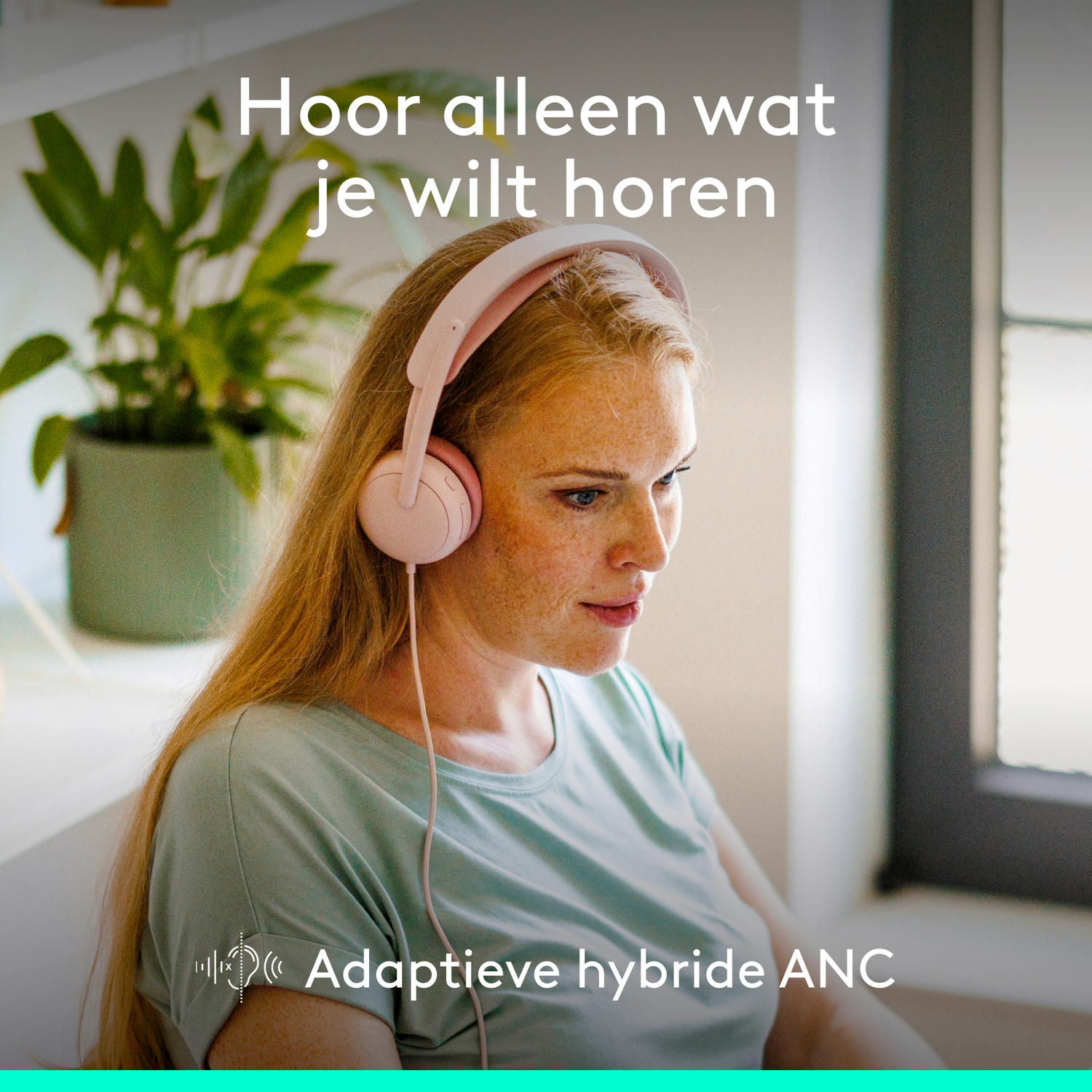 Woman wearing pink headphones, listening. Text: Hear only what you want to hear.