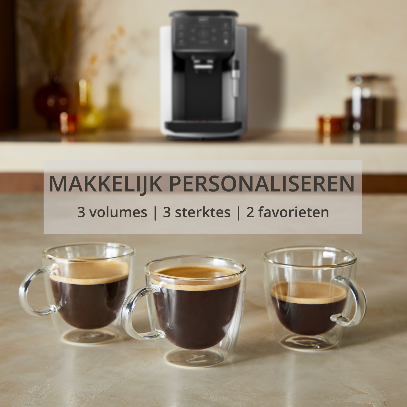 Coffee machine with three espresso cups in double-walled glasses.