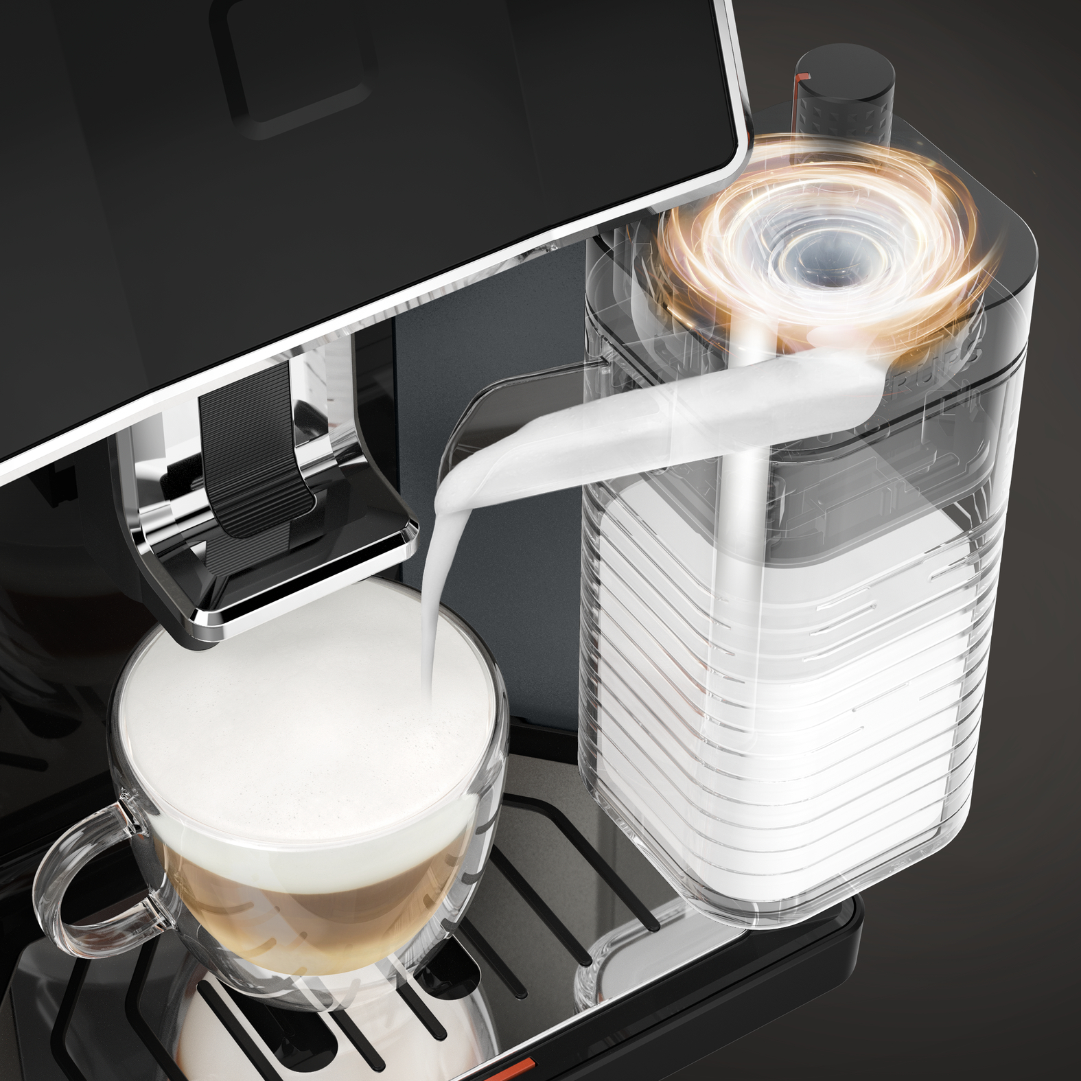 Melk wordt in een glazen beker met koffie en schuim gegoten.
