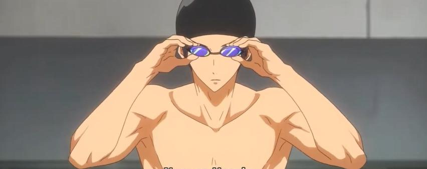 Ein Mann mit schwarzer Badekappe und blauen Schwimmbrillen.