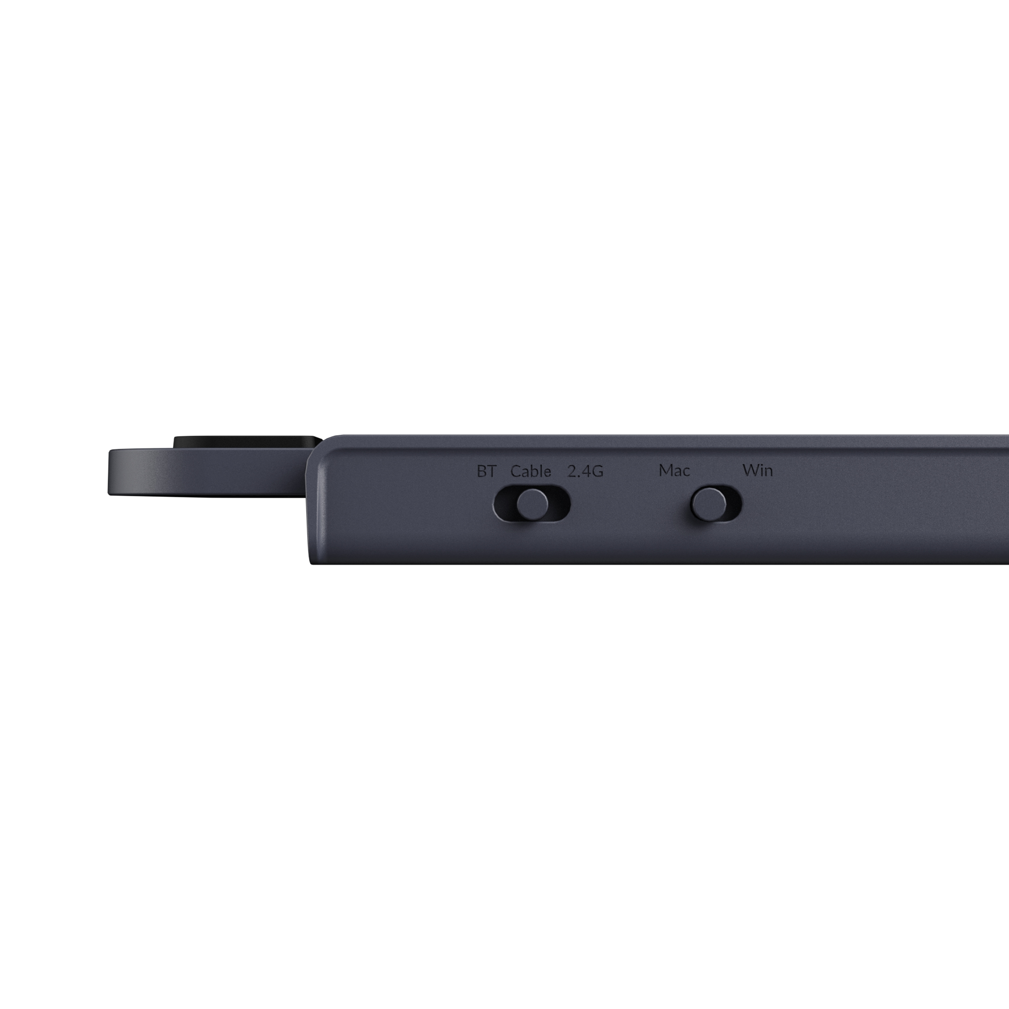 Dunkelgraues Gehäuse mit drei Schaltern: BT, 2.4G, Kabel, Mac, Win.