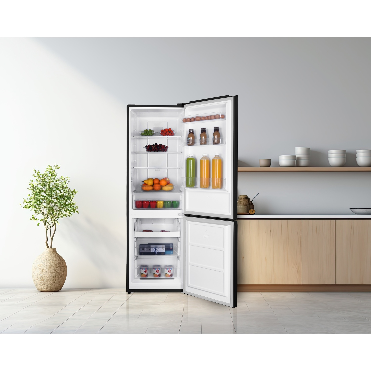 An open refrigerator filled with food items, next to a plant.