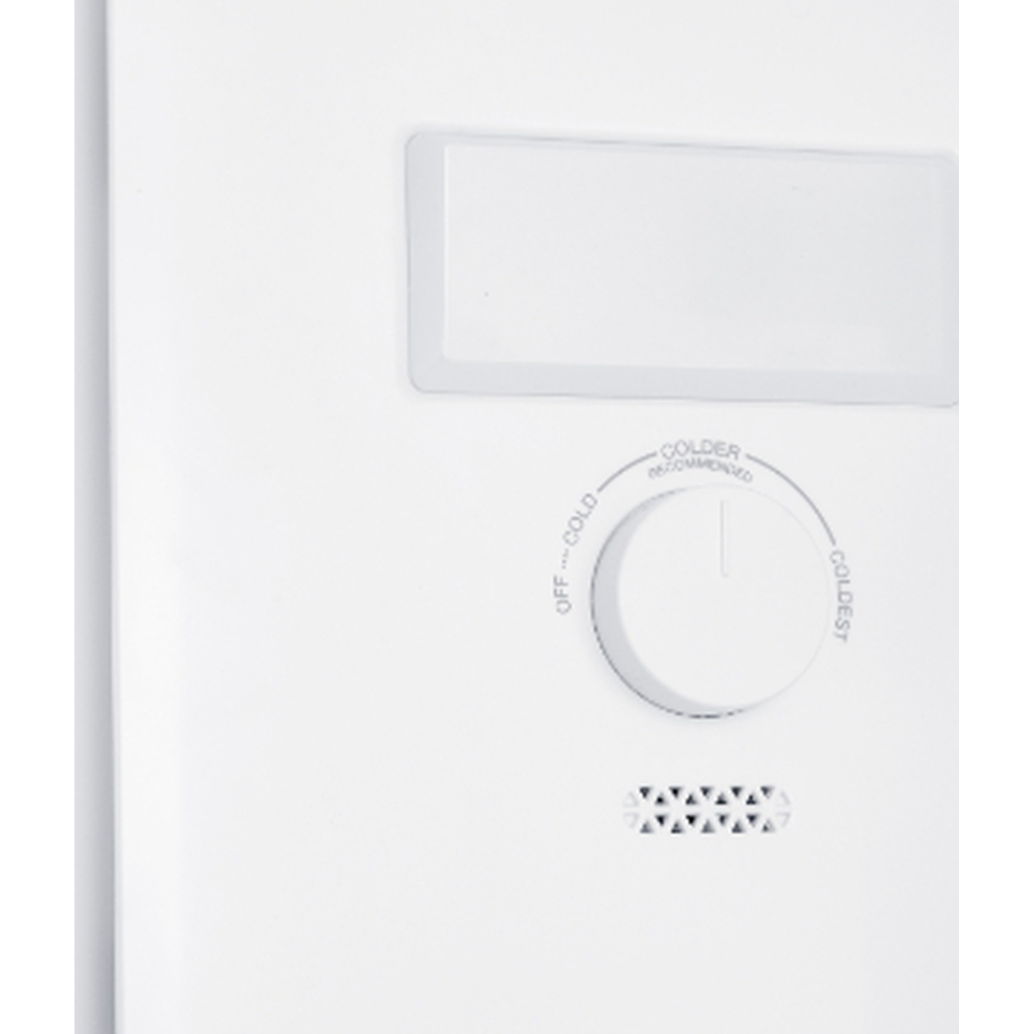 A white thermostat dial with coldness settings and a vent grille.