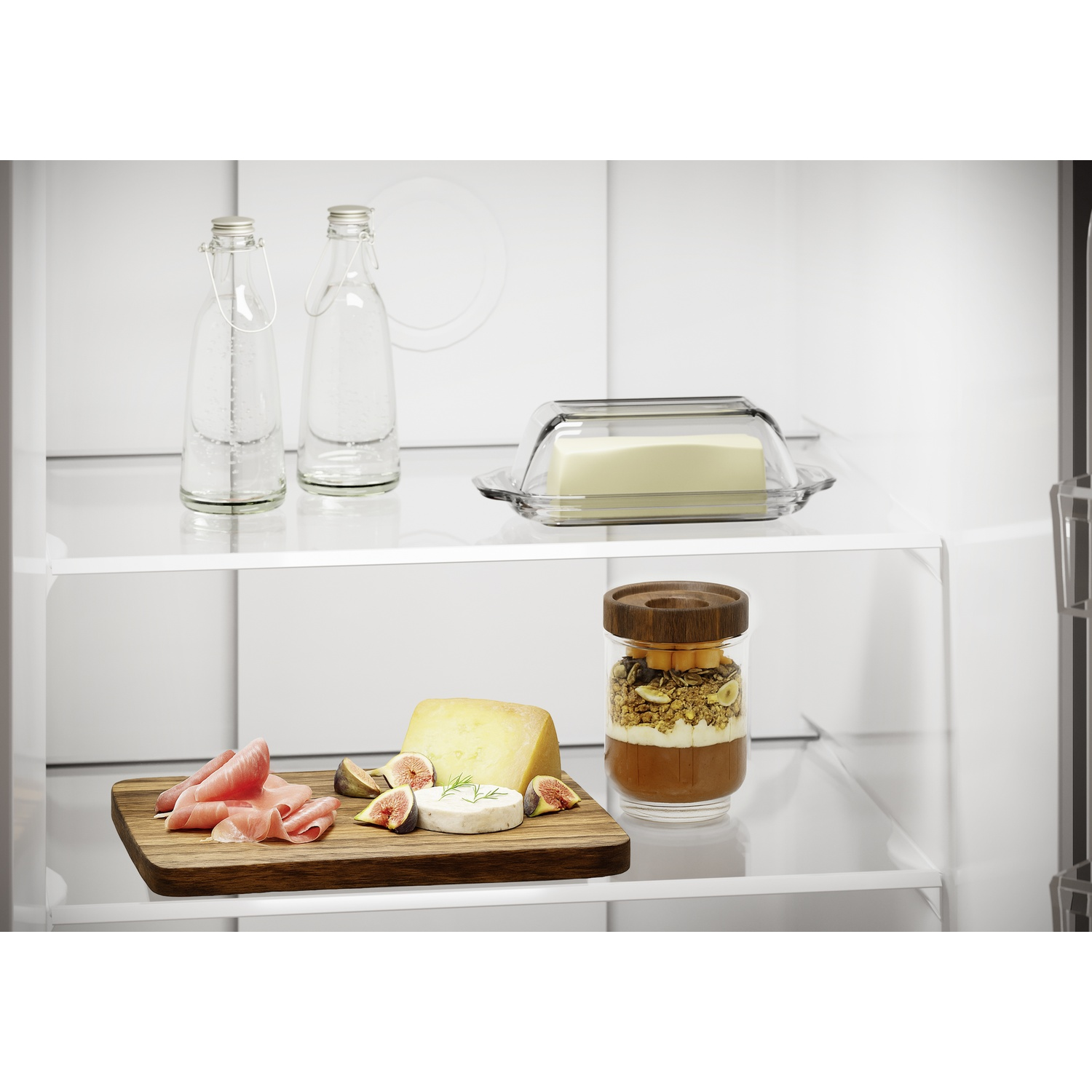 Refrigerator shelves with food: bottles, butter, cheese, ham, figs, and granola.