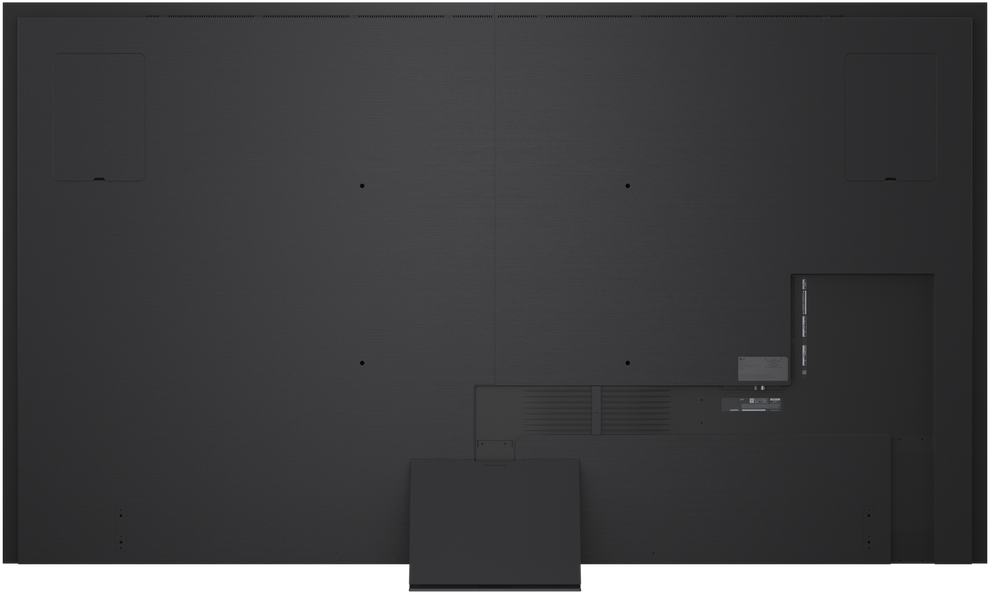 Back of a large black television with ports and ventilation slots.