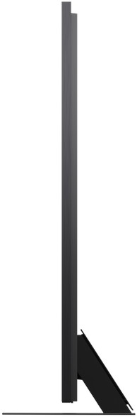 A gray television stands on a black stand, viewed from the side.