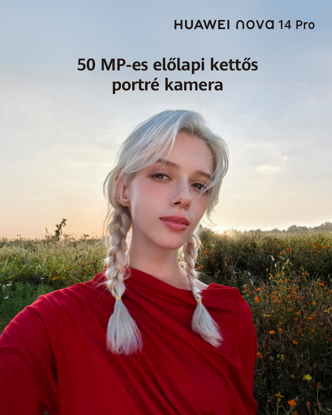 Fiatal nő szőke copfokkal, piros ruhában, mező a háttérben.