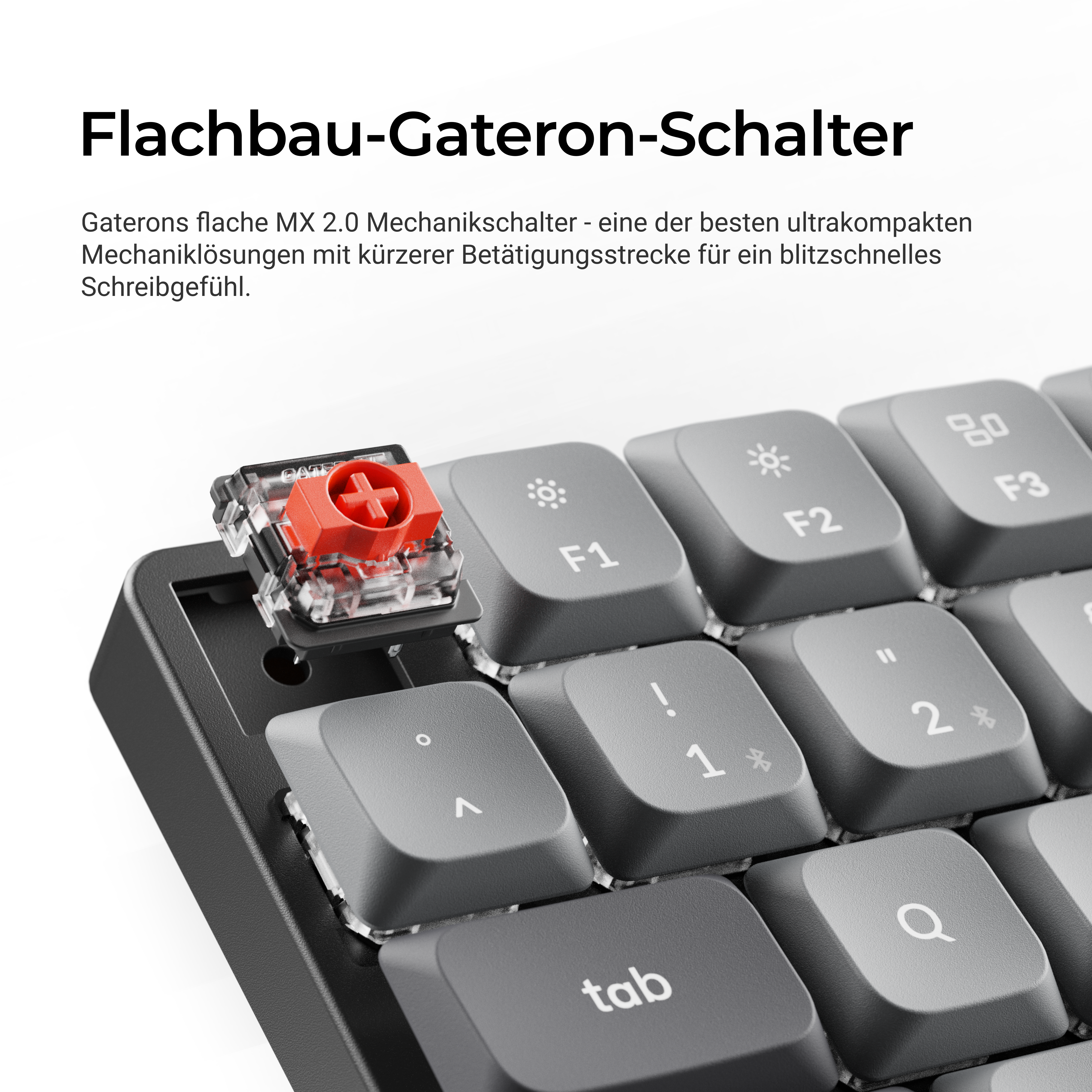 Ein roter Gateron-Schalter auf einer grauen Tastatur. Nahaufnahme.