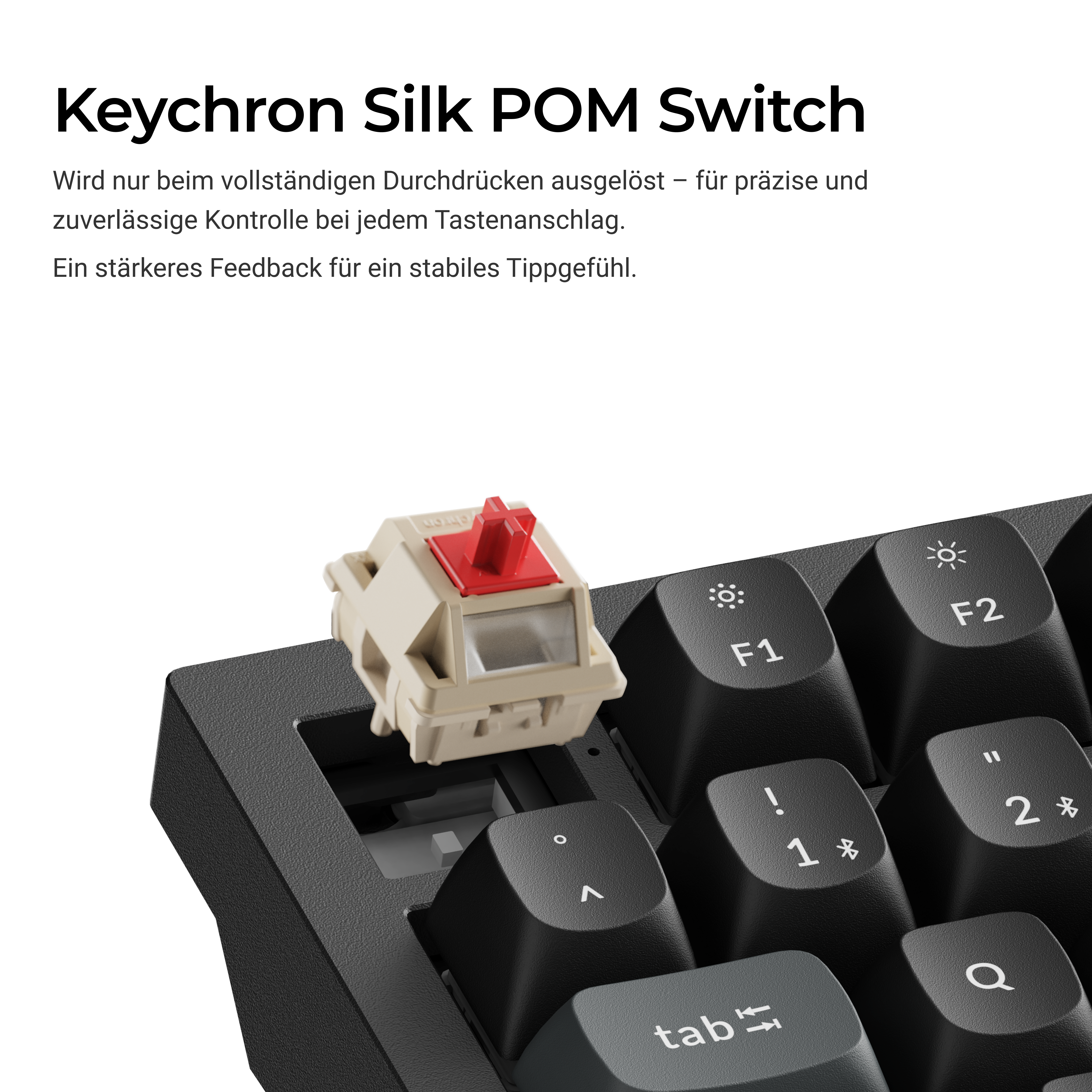Eine Keychron Tastenkappe mit einem beige und roten Schalter daneben.