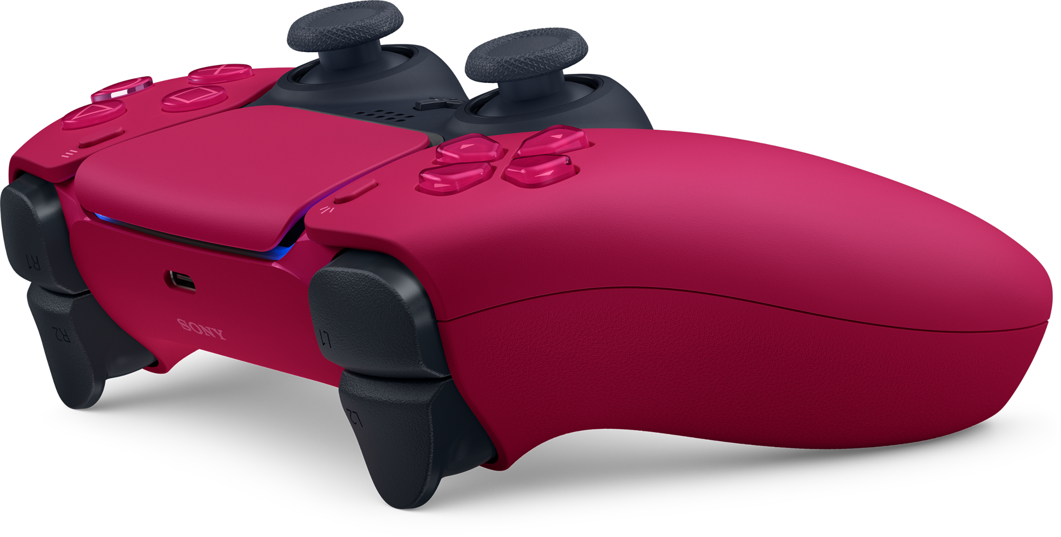 Egy rózsaszín kontroller fekete gombokkal és joystickokkal.