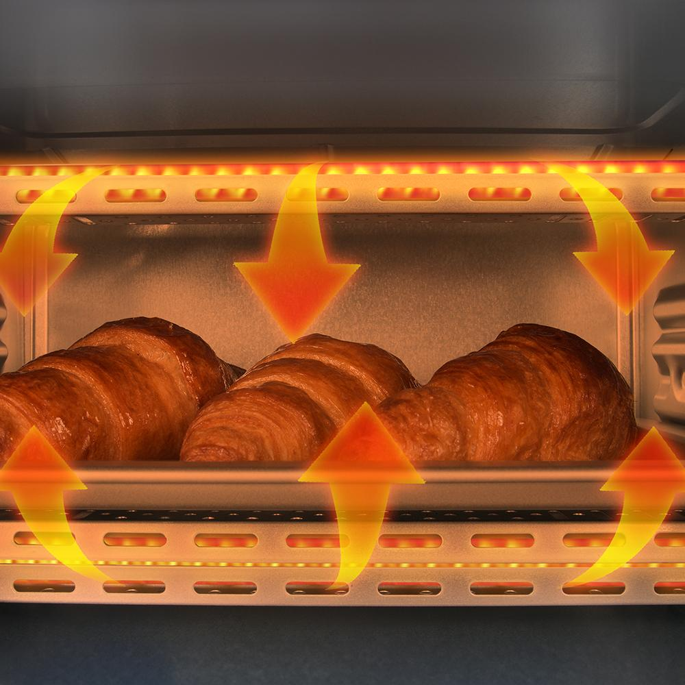 Tres croissants dorados horneándose en un horno, con flechas de calor.
