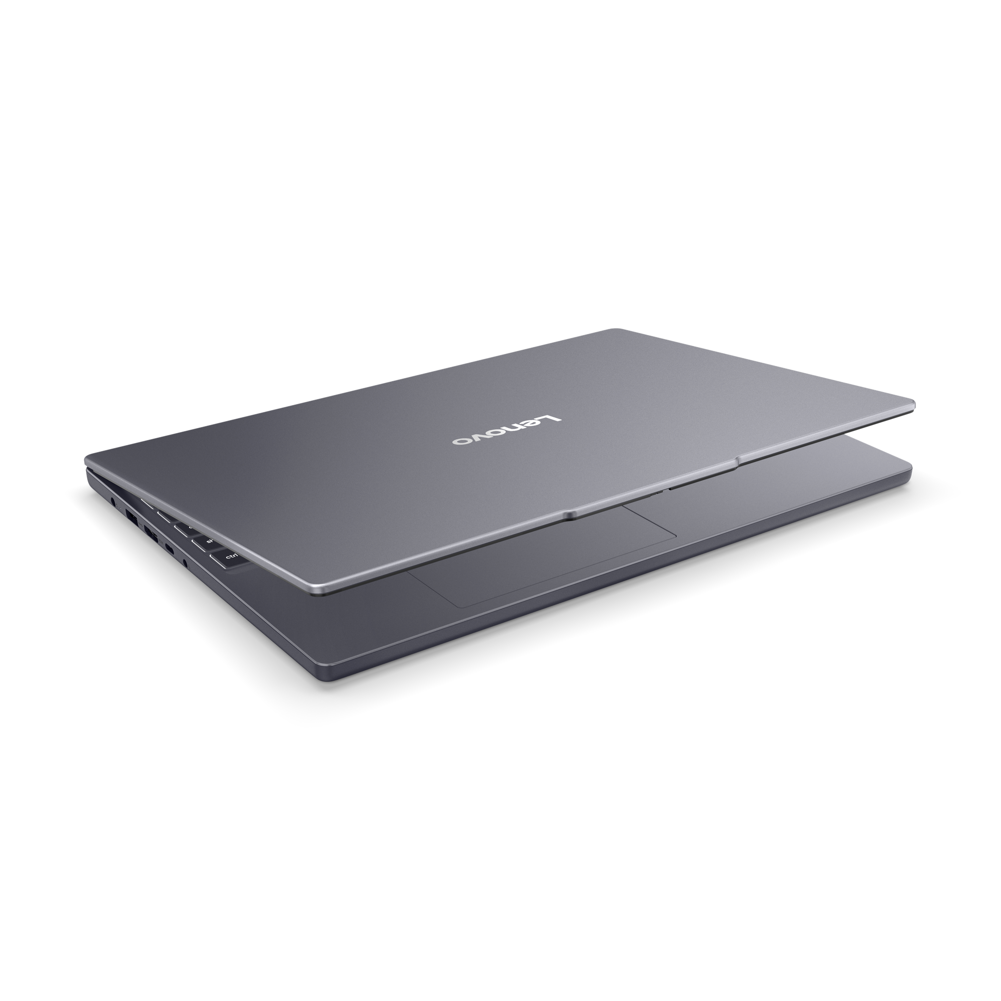 Un ordinateur portable Lenovo gris fermé avec un logo argenté sur le capot.