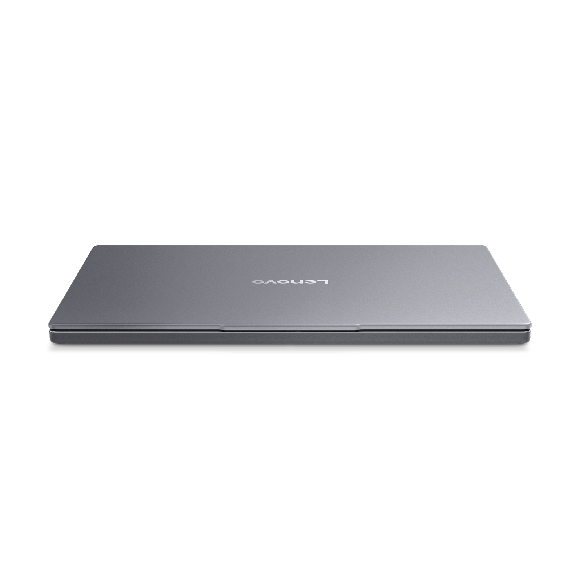 Ordinateur portable Lenovo gris fermé avec logo sur le capot, vu de profil.