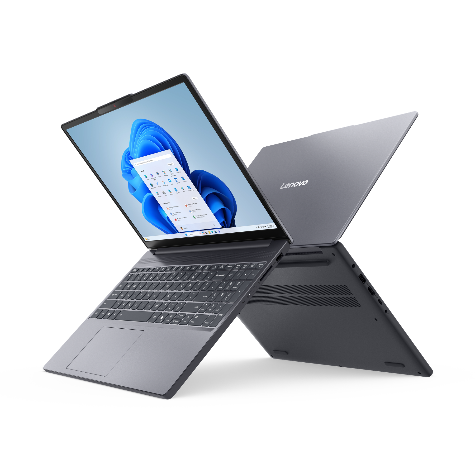 Un ordinateur portable Lenovo gris, écran ouvert, sur fond noir.