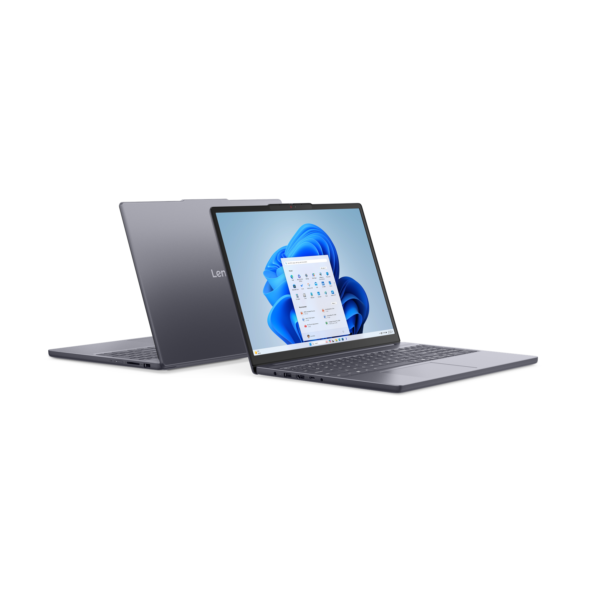 Két szürke laptop egymás mellett, az egyik nyitva Windows 11-et mutat.