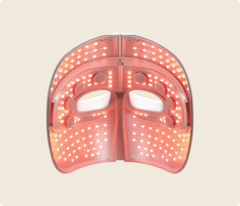 Una mascarilla facial LED blanca con luces rojas para tratamiento.