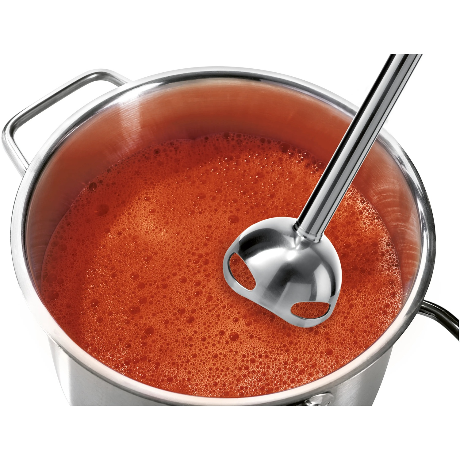 An immersion blender in a pot of red liquid.