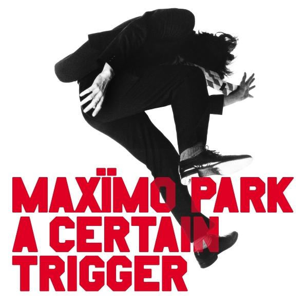 Ein Mann in Schwarz springt, roter Text: MAXIMO PARK A CERTAIN TRIGGER.