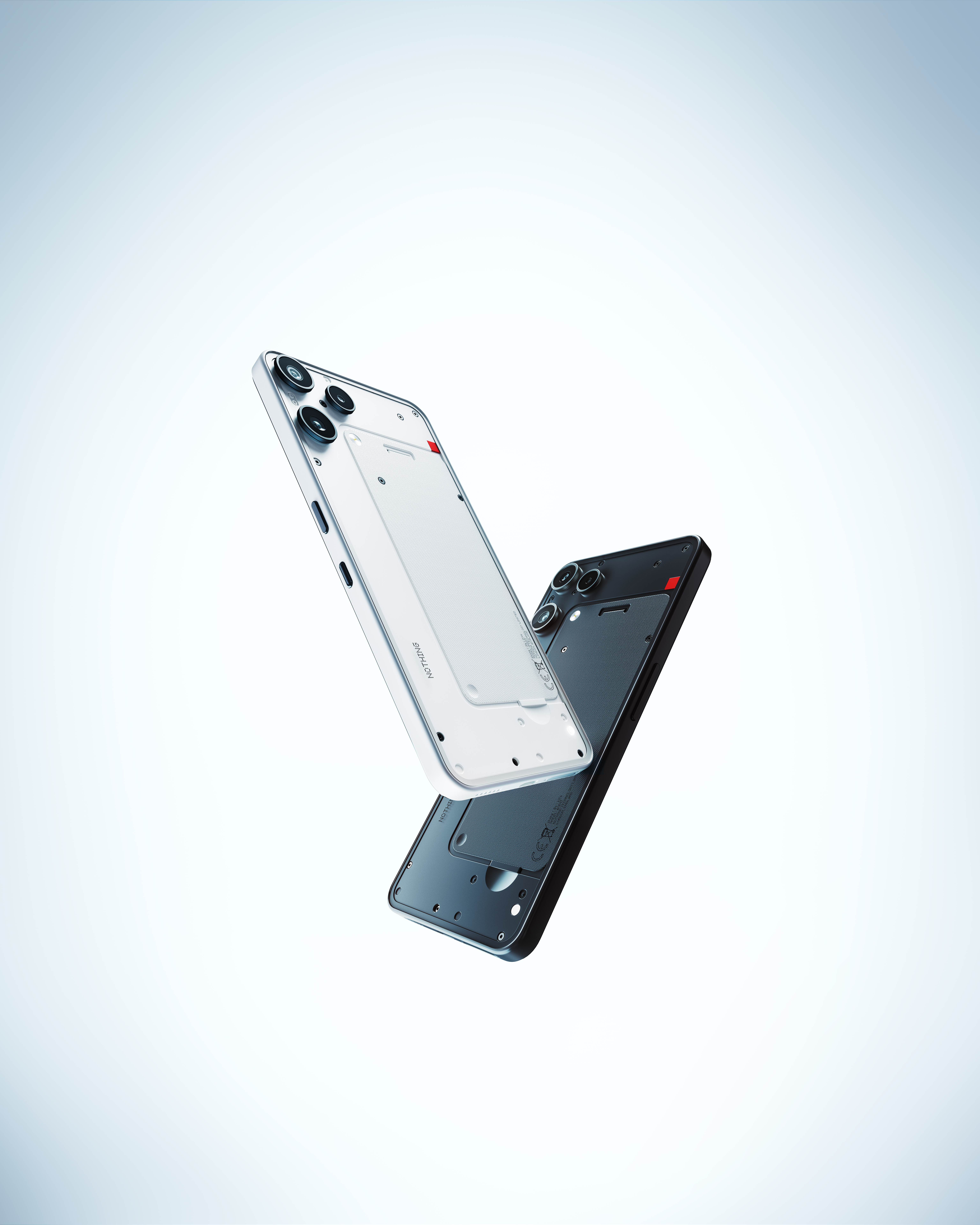 Deux smartphones, un blanc avec caméras, un noir avec caméras, flottent.