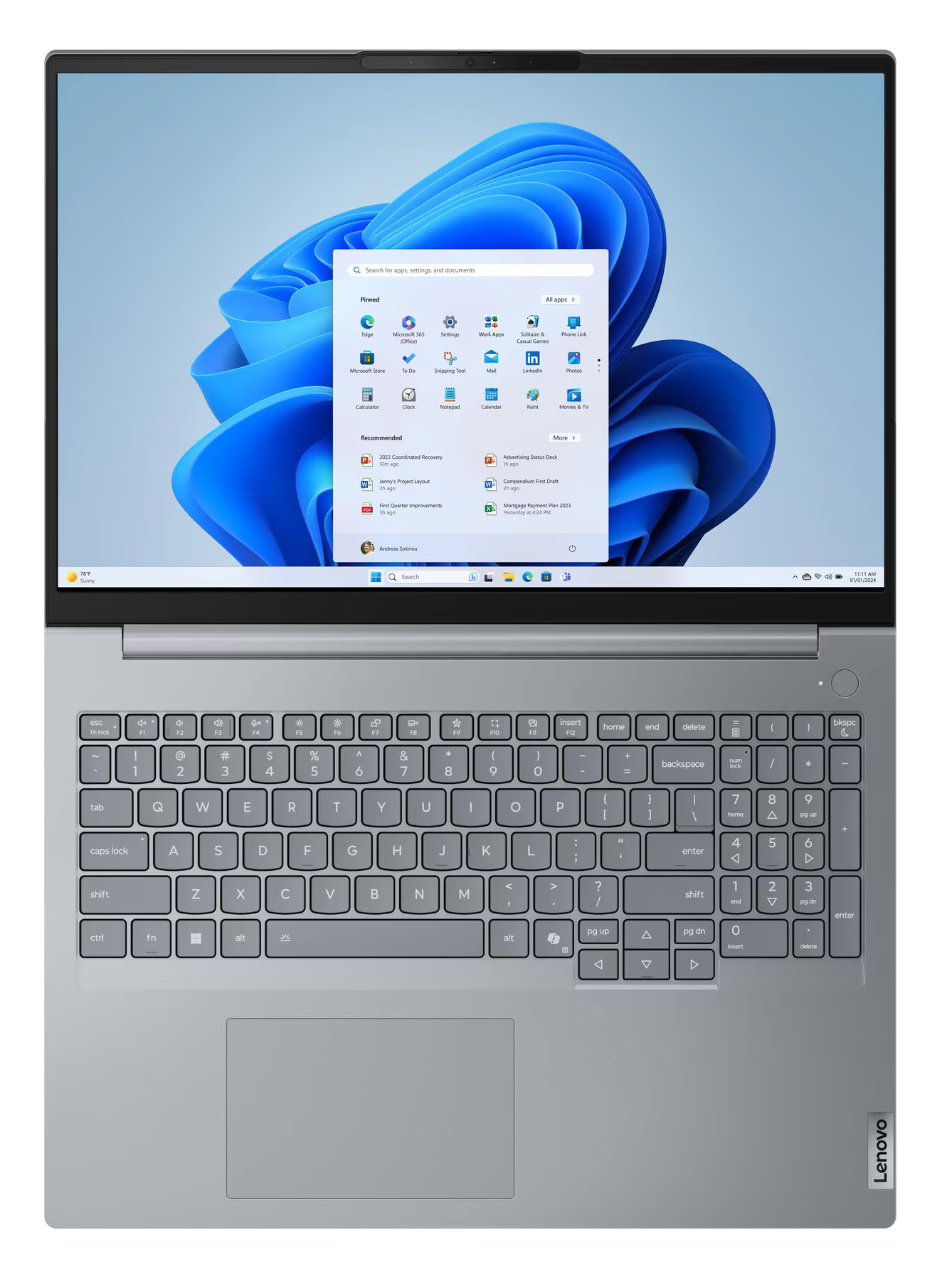 Szary laptop Lenovo z otwartym menu Start na ekranie.