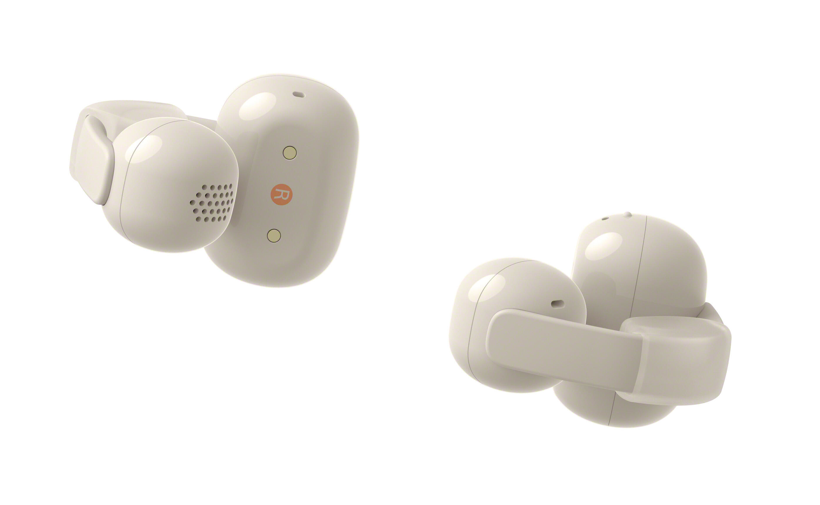 Dwa białe słuchawki z trzonkami ładującymi na białym tle.