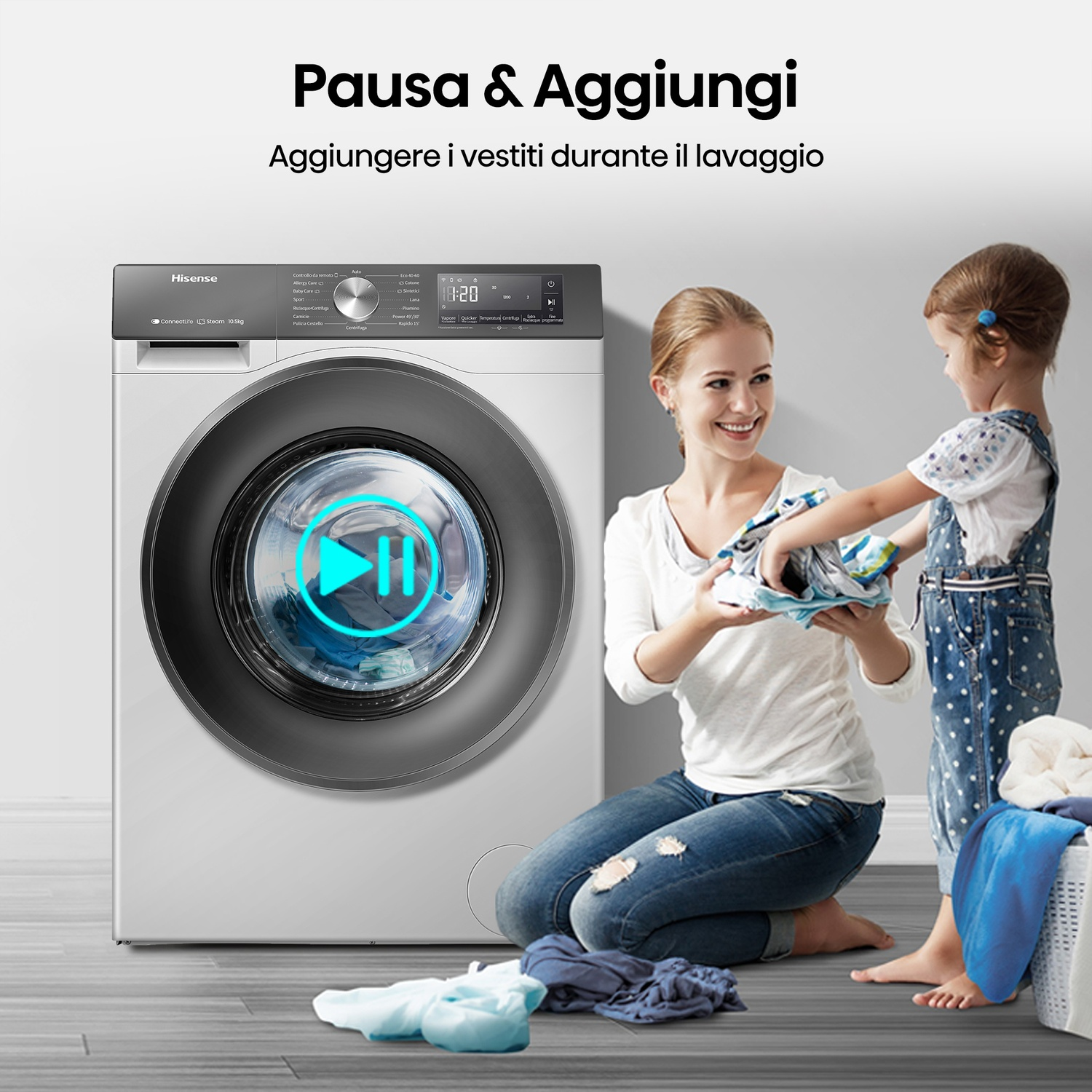 Una donna e un bambino in ginocchio vicino a una lavatrice.