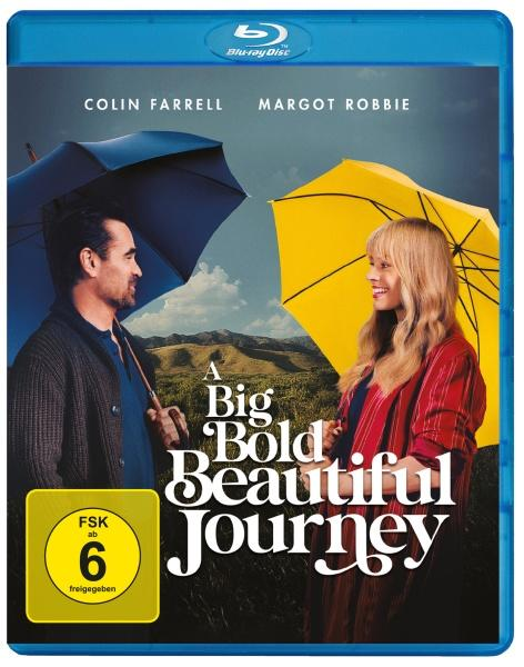 Colin Farrell und Margot Robbie mit Regenschirmen vor hügeliger Landschaft.
