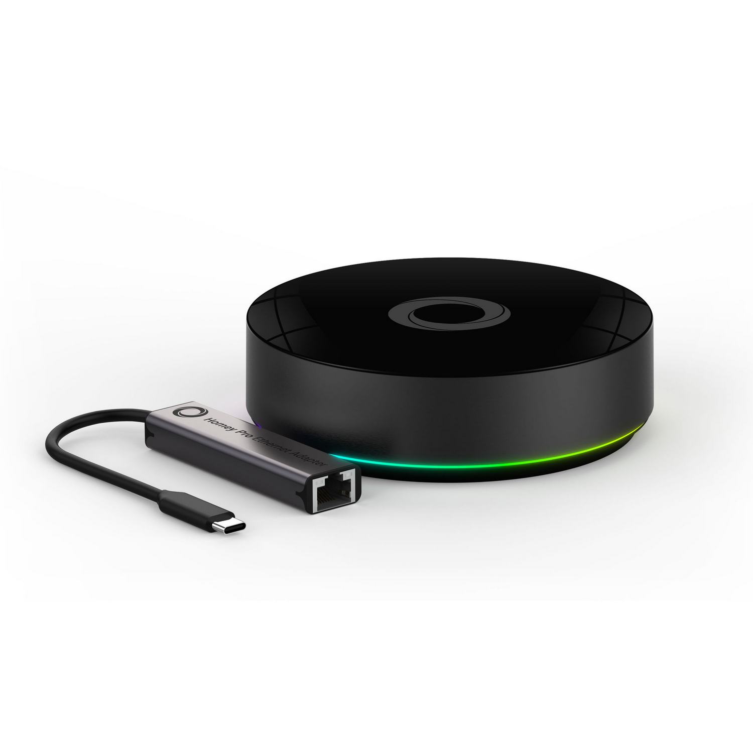Un concentrador redondo negro con indicador de carga y cable adaptador Ethernet.
