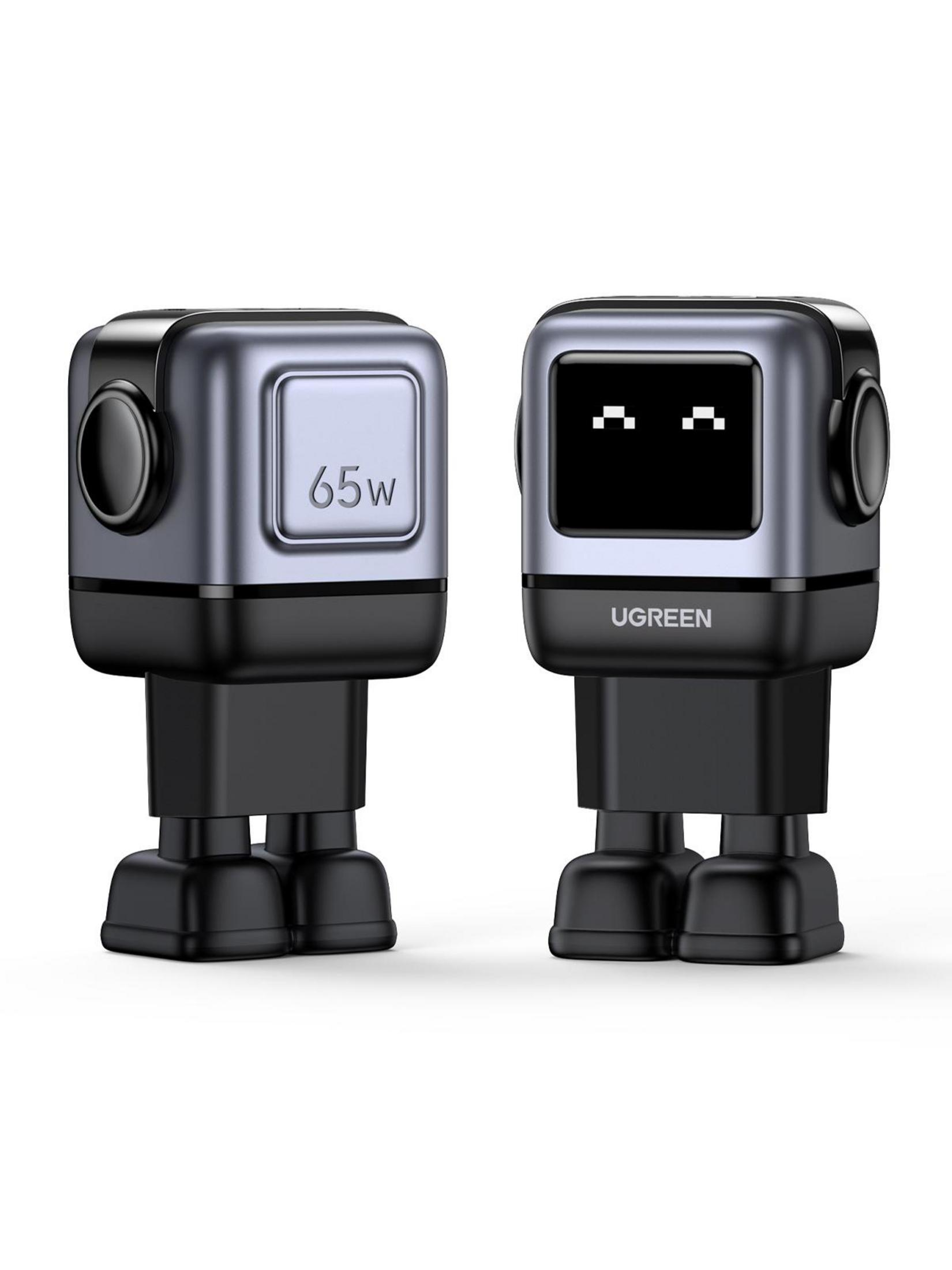 Dos pequeños robots metálicos, uno con "65w", el otro "UGREEN" con ojos de píxel.