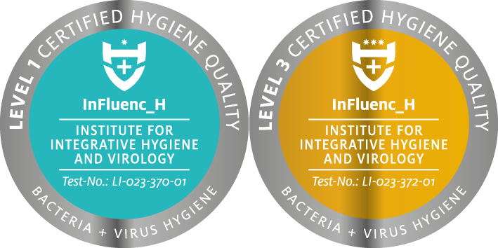 Zwei Siegel: Level 1 in Türkis, Level 3 in Gold, beide für Hygiene.