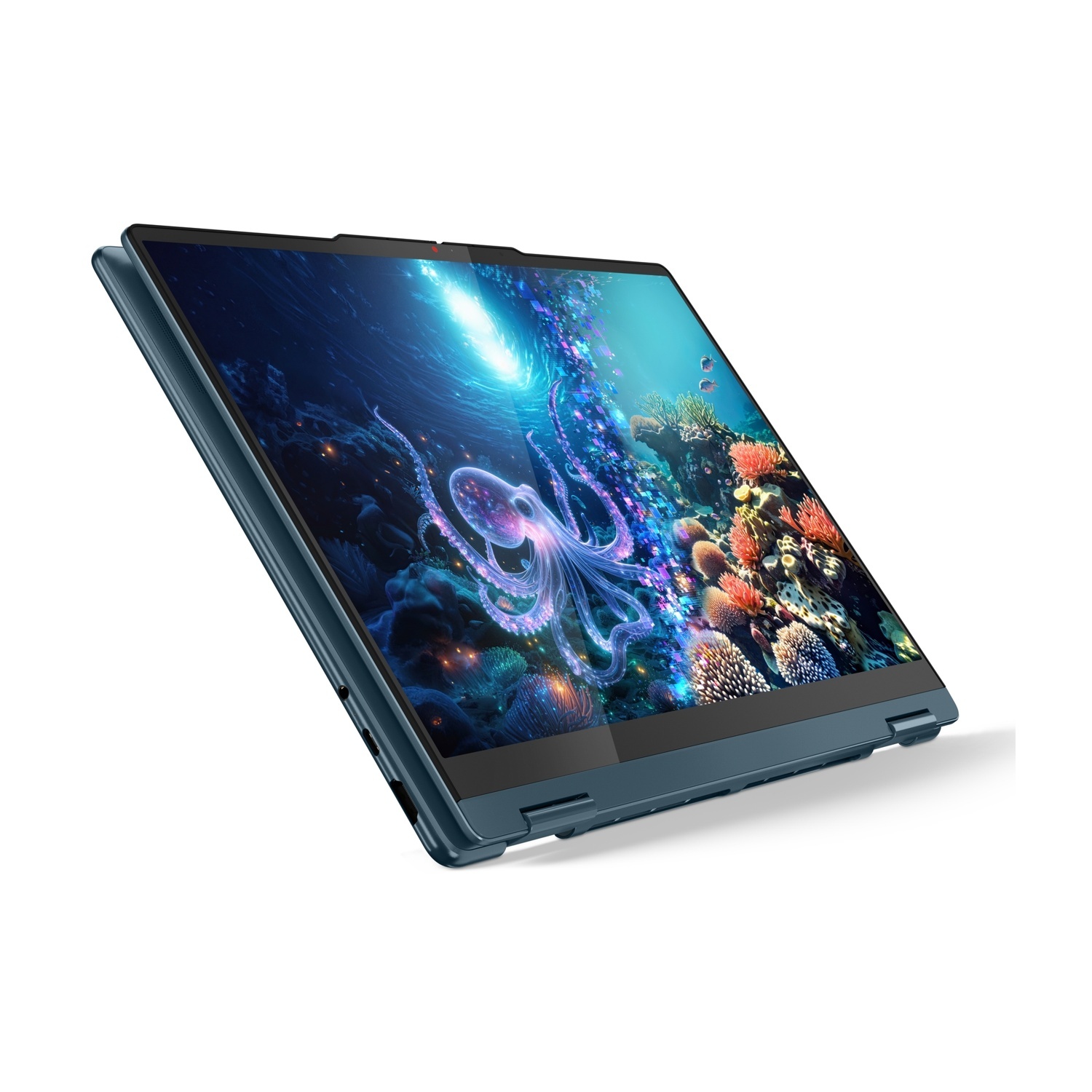 Un laptop blu mostra una scena subacquea con un polpo e coralli sullo schermo.