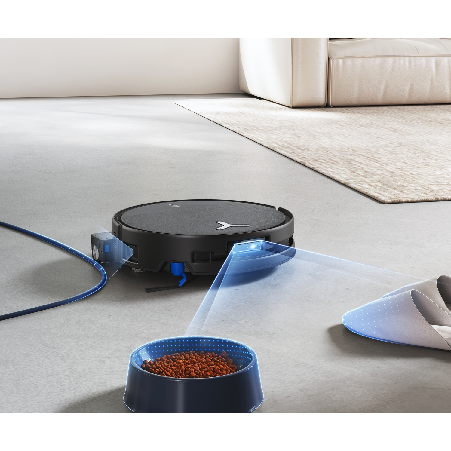 Un robot aspirapolvere nero con cavo di ricarica blu pulisce il pavimento.