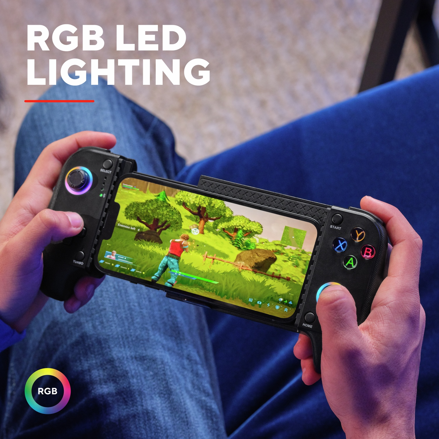 Person playing a mobile game with a controller featuring RGB LED lighting.