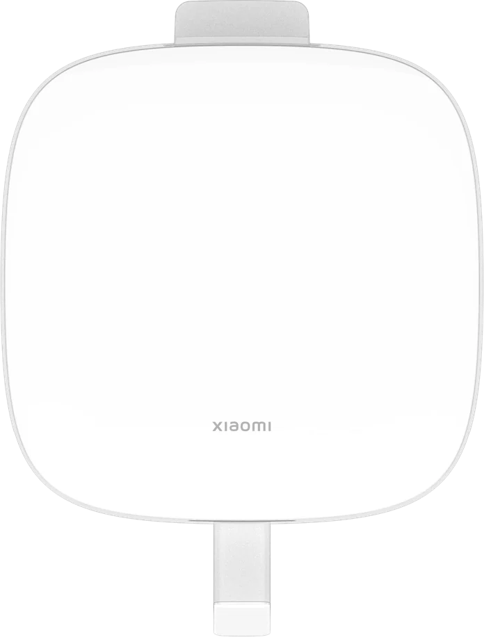 Egy fehér Xiaomi töltő felhajtható dugóval, felülnézetből.