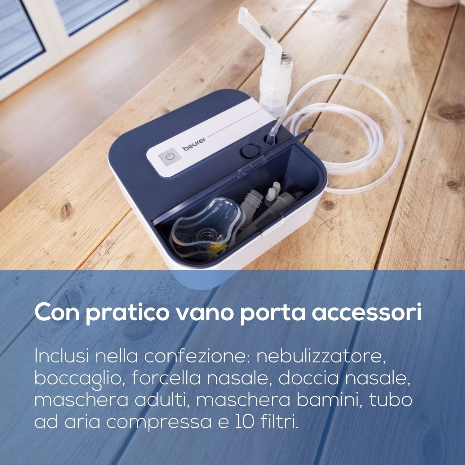 Un nebulizzatore Beurer con vano accessori e tubo su un tavolo di legno.