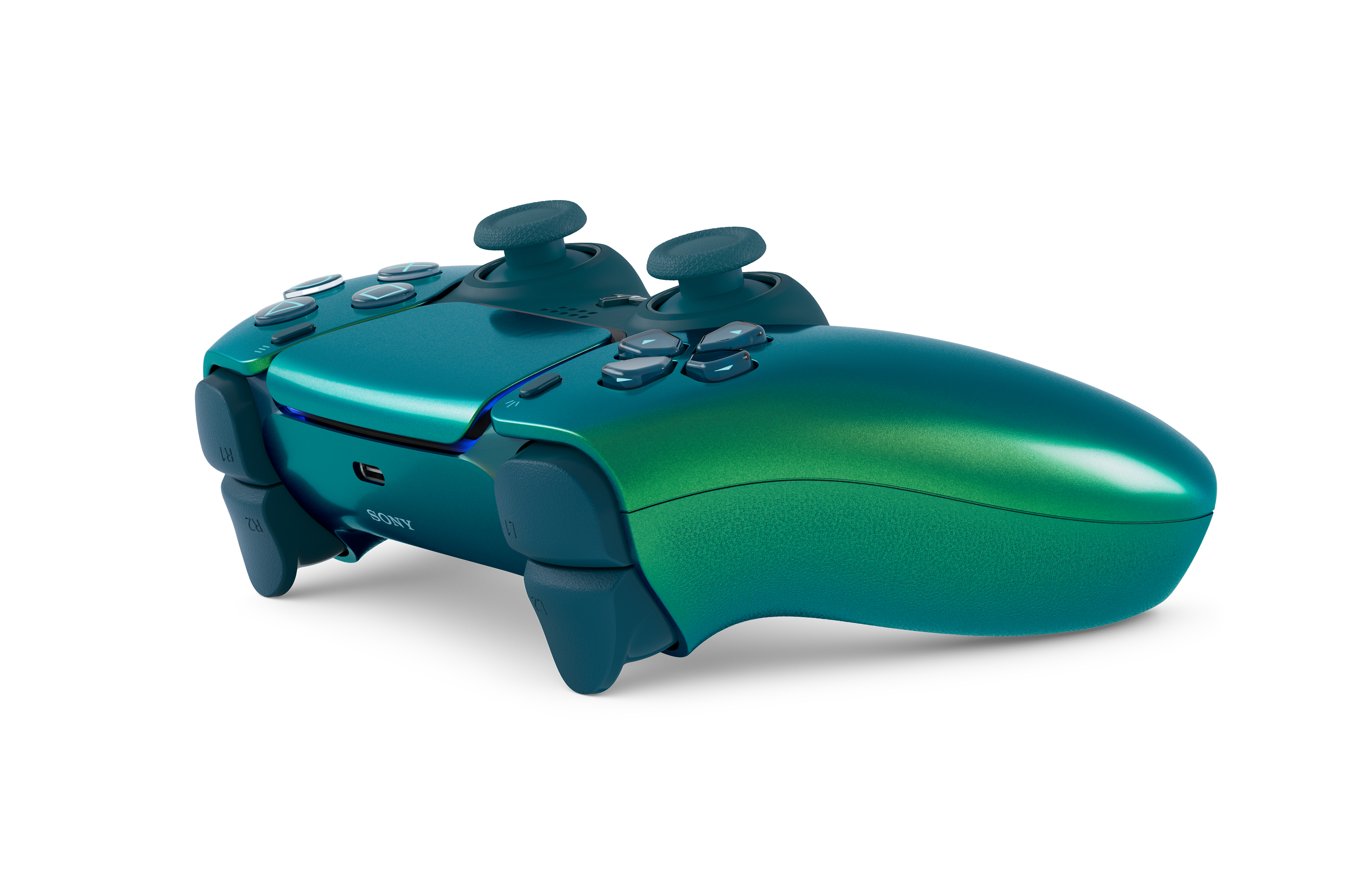 Ein tealfarbener Controller mit zwei Joysticks und Knöpfen, auf weißem Hintergrund.