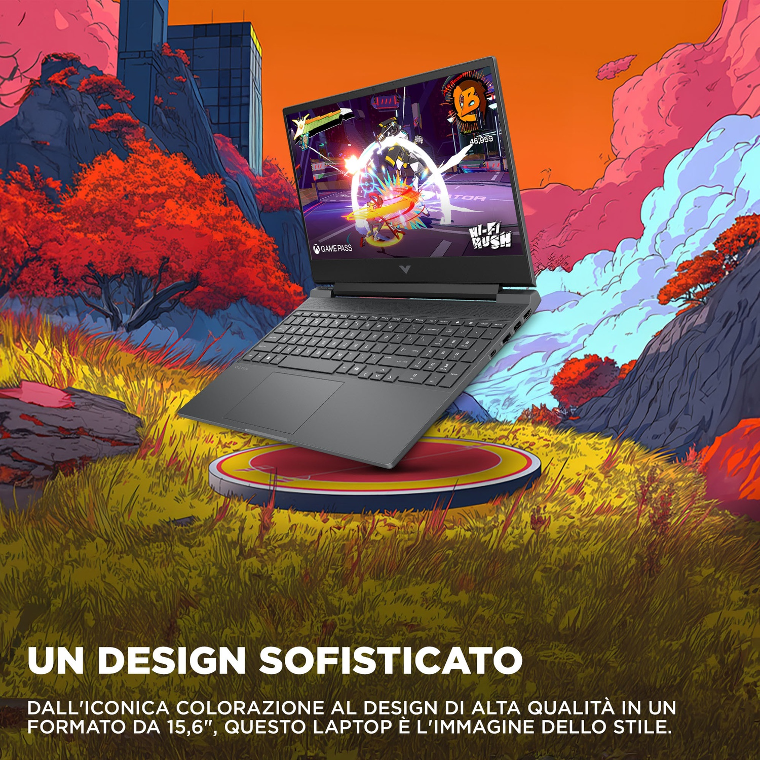 Un laptop con un gioco colorato sullo schermo riposa sull'erba.